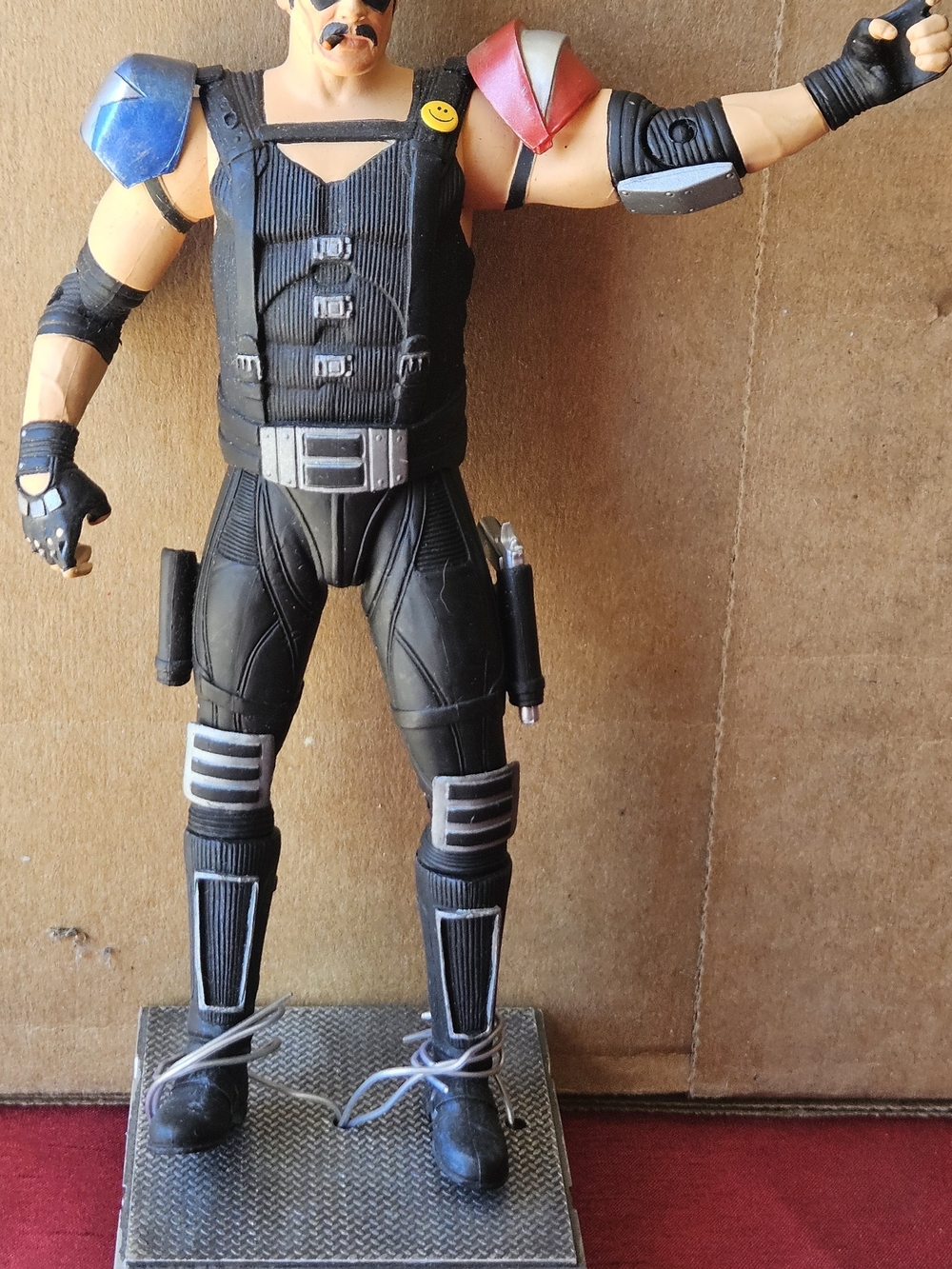 Warner Bros. Action Figure in Black with Blue and Red Accents